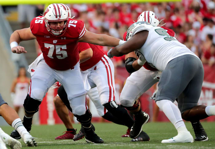 Wisconsin offensive lineman Joe Tippmann blocking against Eastern Michigan in 2021.